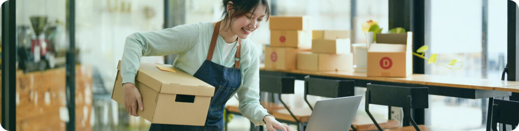 business owner with boxes